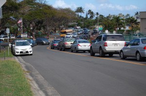 A lineup of Clowns waiting to drive their kids a few blocks home from school, on a beautiful Hawaiian afternoon this January.