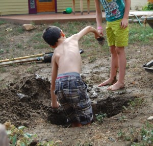 Little MM and a friend from the neighborhood engage in healthy dirtplay.