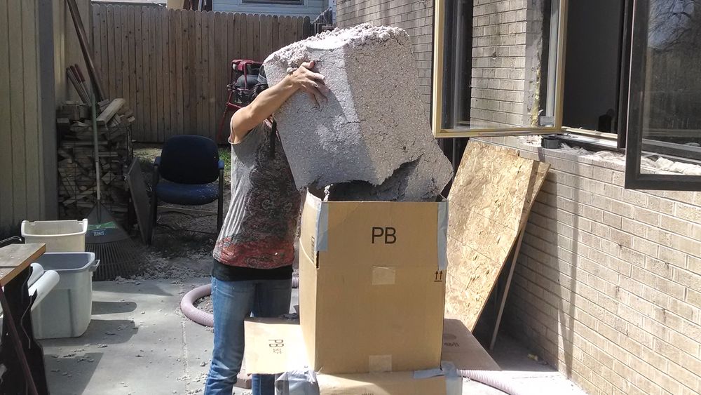 Mrs. MM loads a 20-pound chunk into a homemade cardboard hopper (long story)
