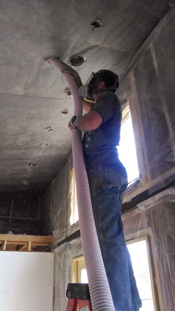 Here I'm blowing cellulose into the vaulted ceiling, supported by fabric.
